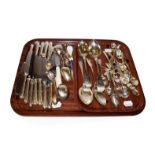 A collection of silver and silver plated flatware, including three Fiddle pattern table-spoons, an