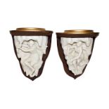A pair of Royal Worcester Parian mounted wall brackets, from a set of four allegorical of the four