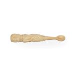 A Victorian carved ivory apothecary spoon formed as a skeleton dressed in a rob, the skull
