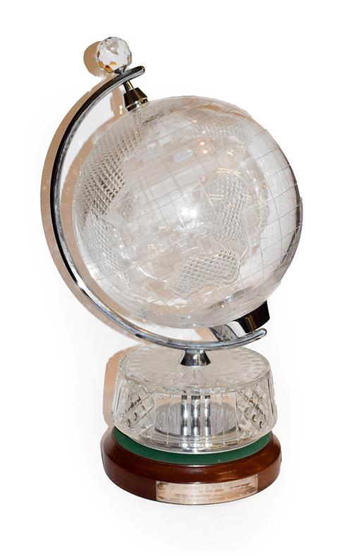 A Waterford cut glass table globe on an oak base bearing presentation plaque, 59cm high . Good