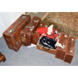 Five graduated tan leather suitcases and a quantity of vintage ladies handbags