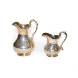 A William IV and a Victorian silver cream-jugs, One by Edward and John Barnard, London, 1857, the