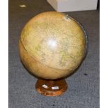 A globe on wooden stand, Philips' Challenge Globe 13 1/2'', 47cm high