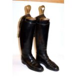 A pair of leather riding boots, spurs and wooden boot trees, size 9