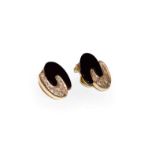 A pair of 18 carat gold diamond and onyx earrings, formed of two interlocking 'C' motifs, one set