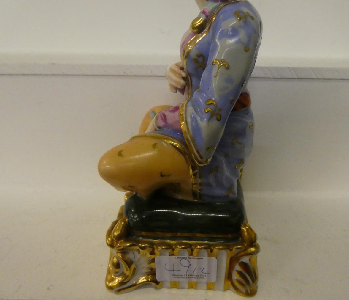 A pair of Paris porcelain figures formed as a seated Turk and his companion, raised in gilt Rococo - Image 6 of 27