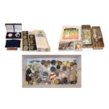 A miscellany of coins, including a George V, 1911 sovereign mounted in a scroll bezel and