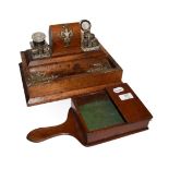 An Edwardian oak desk standish with a pair of cut glass inkwells, together with a mahogany offertery