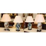 A pair of modern Oriental style table lamps as blue and white vases and covers on wooden stands,