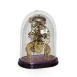 A 19th century brass skeleton clock with fusee movement, striking on a bell and under glass dome,