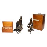 A cased microscope by Baker, another by makers J Swift, cased quantity of microscope slides and