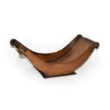 A 19th century mahogany cheese coaster of dish form with scrolled handle, 46.5cm wide