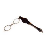 A pair of Victorian tortoiseshell cased lorgnette with spring action, inlaid with a plain yellow