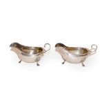 A pair of George V silver sauceboats, by George Howson, Sheffield, 1917, each oval and on three