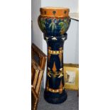 A 19th century Continental earthenware jardiniere on stand, with incised decoration and coloured