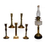A 19th century brass columnar oil lamp and five various 19th century brass candlesticks