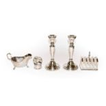 A collection of silver, each piece with Celtic decoration, comprising a pair of candlesticks,