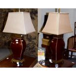 A pair of sang de boeuf style table lamps, with brass effect mounts, 51.5cm high, together with