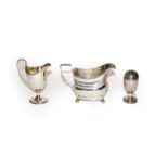 A George III silver cream-jug, a Victorian silver cream-jug and a George III silver pepperette,