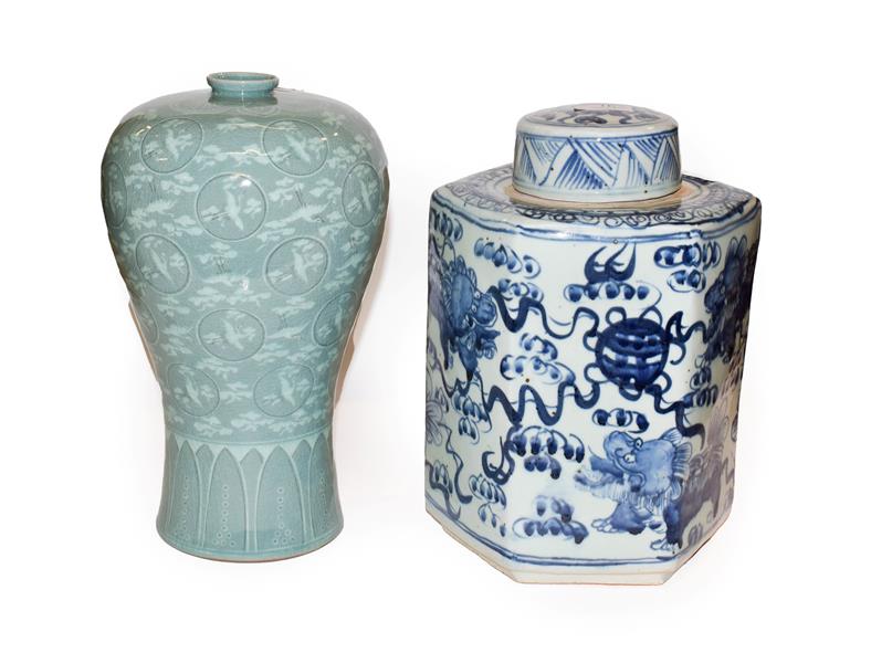 A hexagonal Chinese blue and white jar and cover, painted in underglaze blue with temple dogs