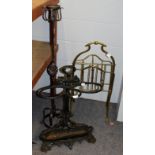 An Edwardian brass magazine rack, stamped Hall, 80cm high, a cast iron stick stand and a wrought