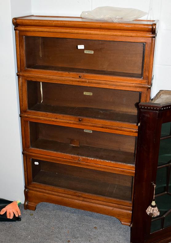 A Globe Wernicke mahogany four-tier bookcase, labelled, 87cm by 27cm by 142cm high . Good condition,