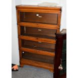 A Globe Wernicke mahogany four-tier bookcase, labelled, 87cm by 27cm by 142cm high . Good condition,