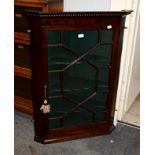 A George III mahogany astragal glazed hanging corner cupboard, 77cm by 104cm high