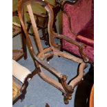 A Victorian carved walnut chair frame, circa 1870, the top rail carved with flowers above acanthus