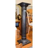 A patinated composite fluted column, 104cm high, top 24.5cm square