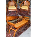 A pair of modern teak tub chairs with cane work panel 60cm by 56cm, 88cm high, seats 44cm high,