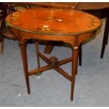 An Edwardian painted satinwood oval occasional table, crossbanded in rosewood, raised on square