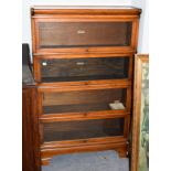 A Globe Wernicke mahogany four-tier bookcase, labelled, 87cm by 27cm by 142cm high . Good condition.