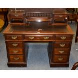 A Victorian walnut twin-pedestal desk, with raised superstructure and leather top, 121cm by 67cm