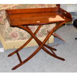 A butlers tray table on folding stand. Good condition. Makers Kennedy of Ipswich.