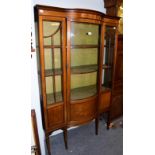 An Edwardian mahogany bow-front display cabinet, 107cm by 42cm by 172cm high