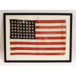 A stitched linen flag for the United States of America, 48 stars, 35cm by 57cm, (framed)