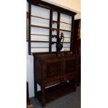 A carved period oak hutch cabinet, 119cm by 43cm by 114cm high; together with an 18th century oak