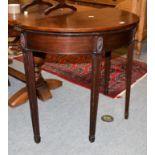 A Georgian mahogany fold-over tea table, raised on square reeded supports, 87cm by 43cm by 74cm high