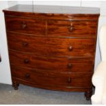 A Victorian mahogany bow-front chest of drawers, raised on turned feet, 115cm by 54cm by 116cm