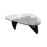 A Modern Isamu Noguchi Coffee Table, model No. IN-50, the shaped triangular glass top 2cm thick,