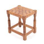 A Sid Pollard of Thirsk English Oak Stool, with leather lattice seat, on four octagonal legs