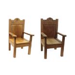 A Pair of Yorkshire School English Oak Child's Armchairs, with panel backs and solid seats, on
