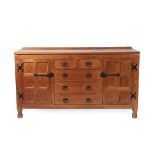 A Sid Pollard of Thirsk English Oak Panelled Sideboard, with raised upstand, above two short drawers
