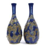 George Tinworth (1843-1913) for Doulton Lambeth: A Large Pair of Stoneware Vases, with applied