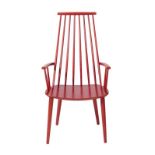 A FDB Mobler Danish Stick Armchair, stained red, labelled FDB MADE IN DENMARK MOBLER BY F.D.B