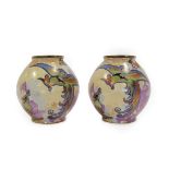 A Pair of Art Deco Carlton Ware Chinese Bird Pattern Ovoid Vases, enamelled in colours on a yellow