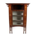 An Art Nouveau Leaded Glazed and Marquetry Inlaid Mahogany Display Cabinet, with an overhanging