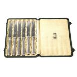 A Set of Six Arts & Crafts Liberty & Co, Silver Tea Knives, each with beaten handles, maker's mark L