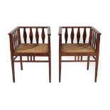 A Pair of Arts & Crafts Oak Tub Chairs, with reeded top rail above oval splats, drop-in rope weave